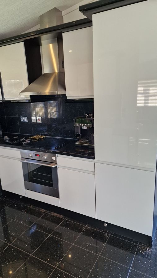 Light grey gloss tall unit and oven run